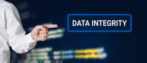 Male hand points to the word data integrity with technology background. Technology concept.