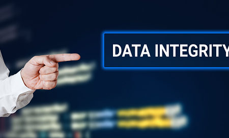 Male hand points to the word data integrity with technology background. Technology concept.
